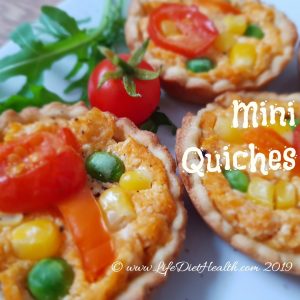 Three mini vegetable quiches with rocket & tomato