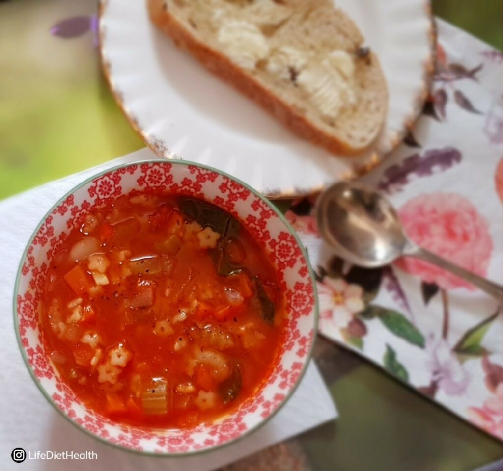minestrone soup with a side of buttered toast