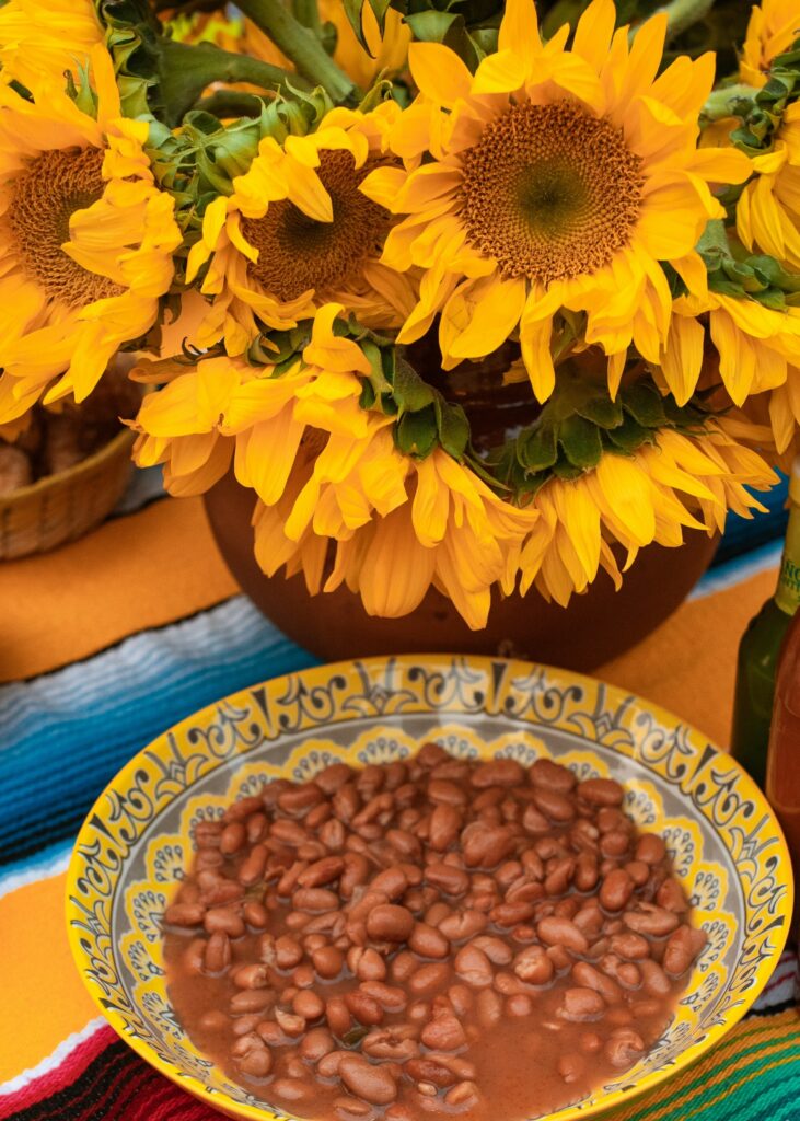 Bowl of pinto beans with sunflowers