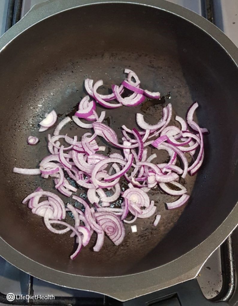 red onions in a pan